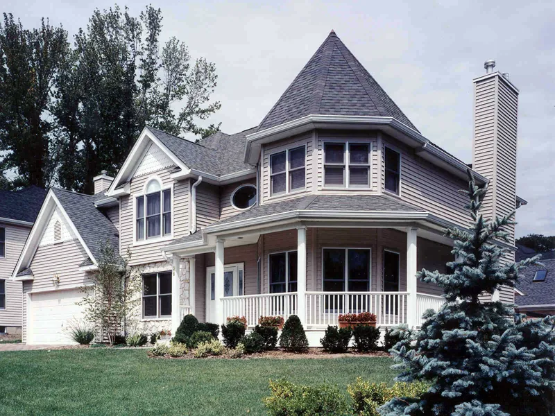 Victorian Style House With Striking Turret Wrapped By A Covered Porch