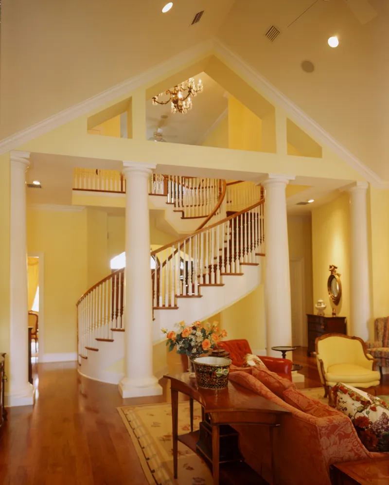 Great room featuring large columns across from the entry.