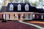 Brick Home With Sweeping Front Covered Porch And Triple Dormers