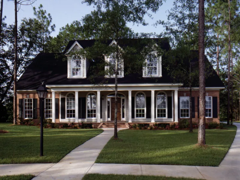 Symmetrical Southern Home With Triple Front Dormers