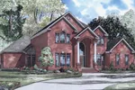 Grand Columns Flank The Front Entry Of This Luxurious Two-Story Brick Home