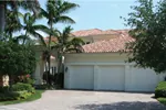 Floridian Style Stucco Home With Clay Tile Roof