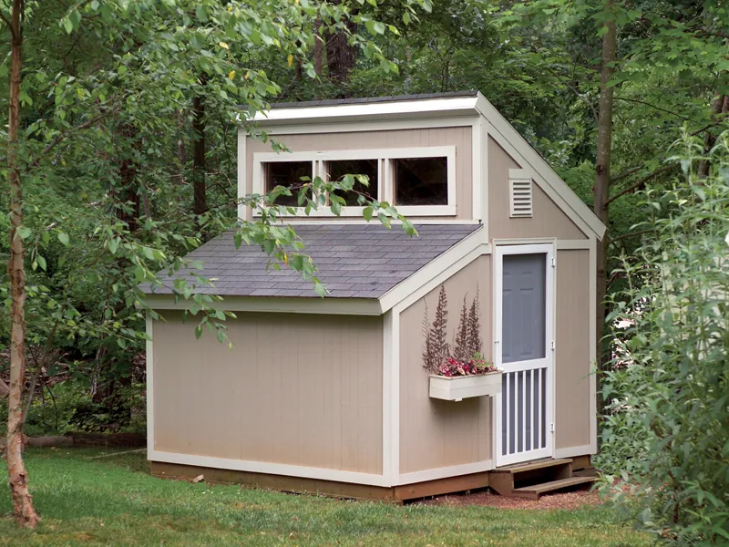 Garden sheds with clerestory window on top has a conveneint side door and window with planter box