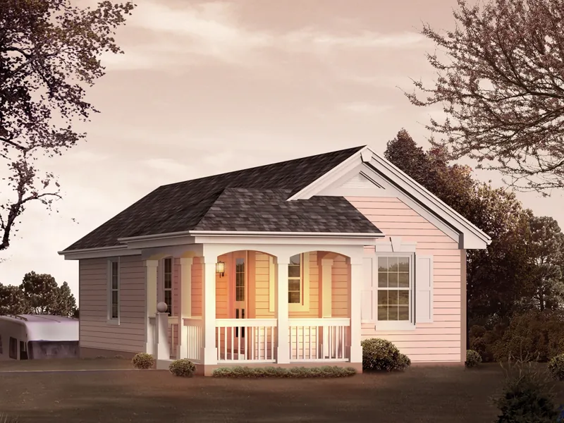 Small cottage style structure with a covered porch is actually an RV garage with a rear entry