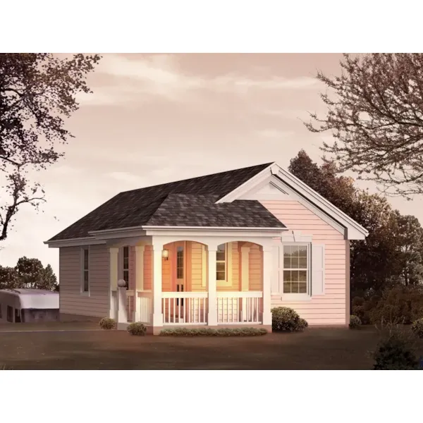 Small cottage style structure with a covered porch is actually an RV garage with a rear entry