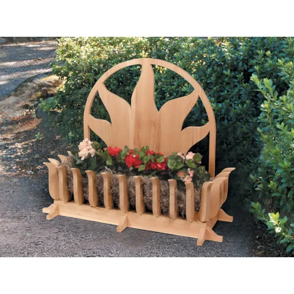 All wood ground level planter has sun shaped motif design on the back