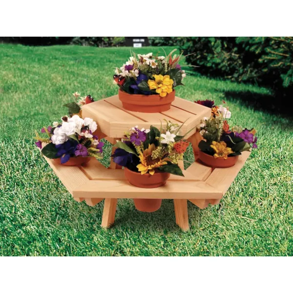 Small hexagon wood picnic table holds multiple clay flower pots