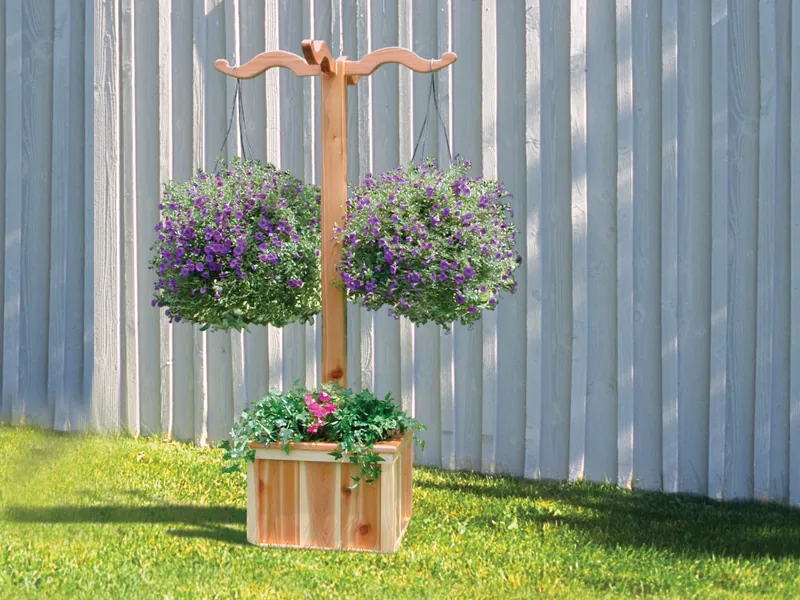 Freestanding hanging planter box hangs two plants and allows flowers to be planted in the square base