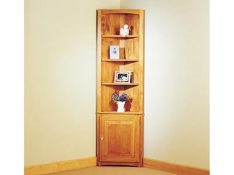 Space efficient cozy corner cupboard offers a great place to display collectibles