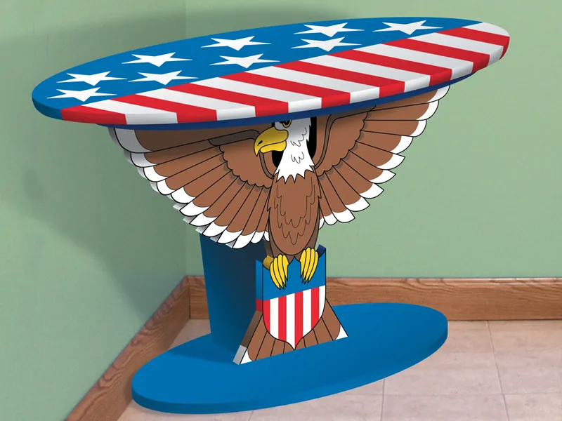 This patriotic table has a bald eagle design as the stand with a stars and stripes pattern on the top