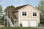Two-story garage aprtment has side outdoor stairs and classic Tudor style trimwork