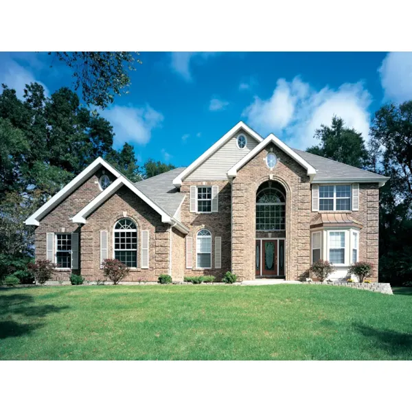 Tall, Arched Entrance With A Pleasing Brick Façade