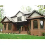 Bayed Windows Frame The Front Entry Of This Home