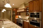 Arts & Crafts House Plan Kitchen Photo 01 - Greenwood Springs Luxury Home 013S-0010 - Search House Plans and More