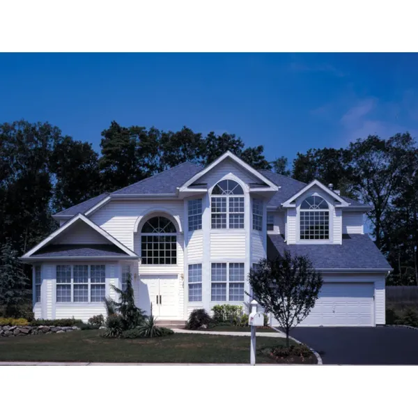 Dramatic Two-Story With Half-Round Windows