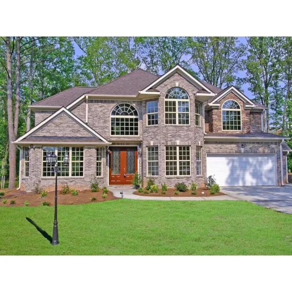 Brick Two-Story With Dramatic Double Bay Window