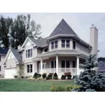 Victorian Style House With Striking Turret Wrapped By A Covered Porch