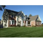 Charming Two-Story Home With Covered Porch, Bay Window And Trellis Style Arch Over Door 