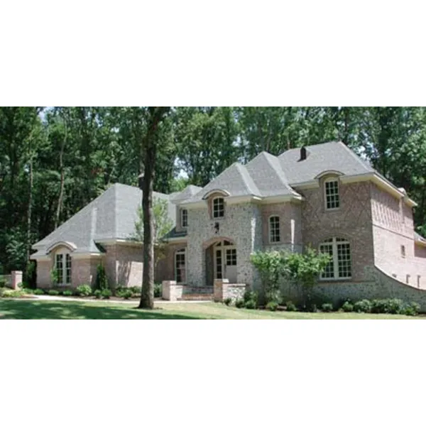 Two-Story Tudor Home With Brick Pattern details And Stonework