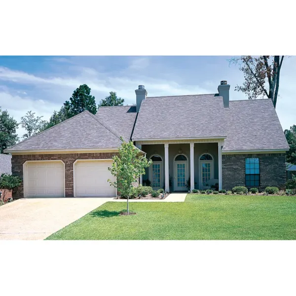 Ranch House With Arched Windows And A Covered Front Porch