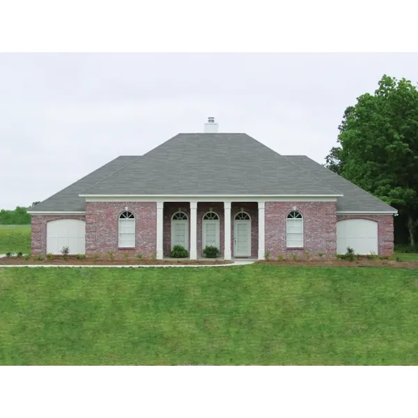 Stately Brick And Columns Decorates The Façade