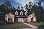 Symmetrical Southern Home With Arch Windows And Covered Porch