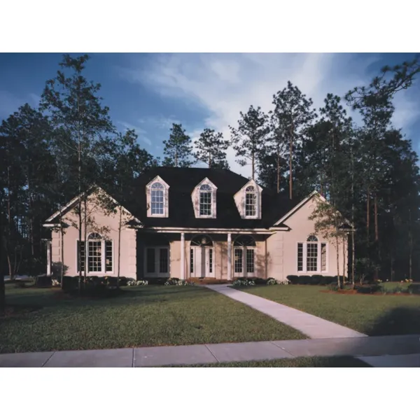 Symmetrical Southern Home With Arch Windows And Covered Porch