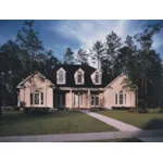 Symmetrical Southern Home With Arch Windows And Covered Porch