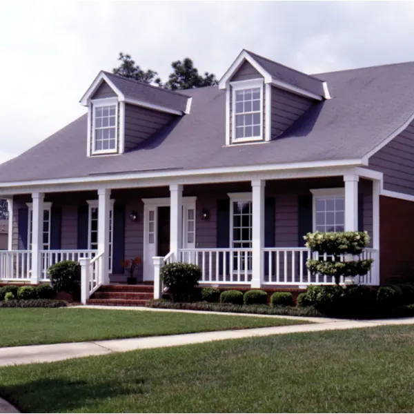 Country-Style Home With Cozy Covered Porch And Twin Dormers On Roof