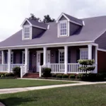 Country-Style Home With Cozy Covered Porch And Twin Dormers On Roof