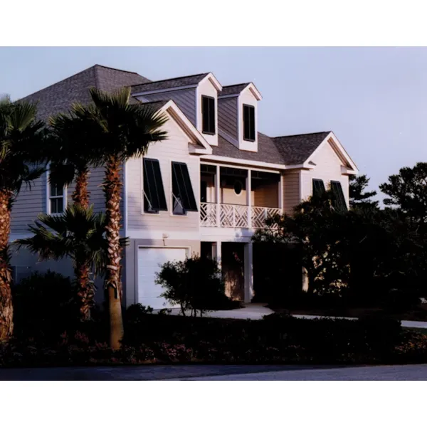 Raised Beach Style Home Has Drive Under Garage And Covered Porch