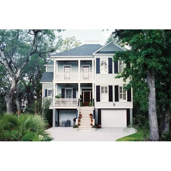 Raised Plantation Style Home With Grand Front Staircase To Deck 