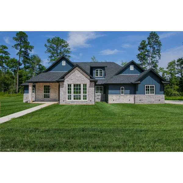 Stone Accents And Dormer Grace This Country Home