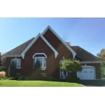 A Stunning Bay Window Captures This Brick Ranch Home