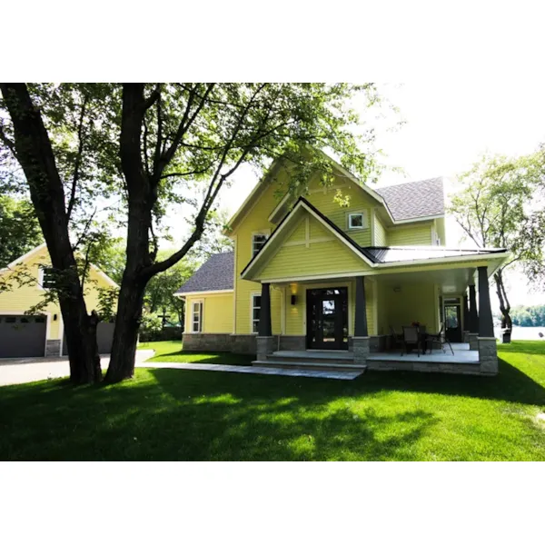 Country Farmhouse Has Covered Porch And Window Walls