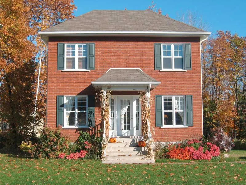 A Decorative Dormer Tops This Colonial Inspired Home