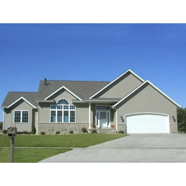 Focal Arched Top Window Livens This Traditional Home