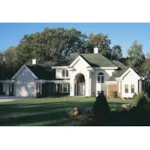 Two-Story Stucco Home With Grand Arched Front Entryway