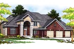 Grand Two-Story Home With Stucco Accenting The Front Entry