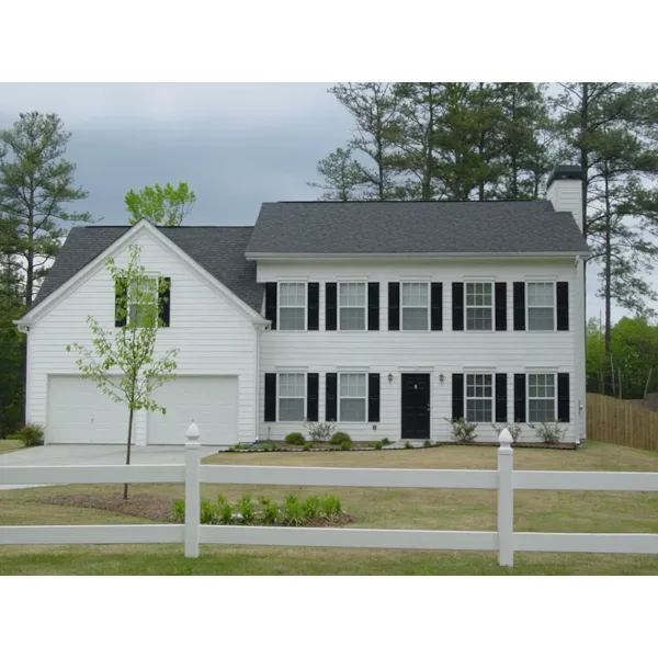 Colonial And Georgian Styles Merge To Create This Two-Story House