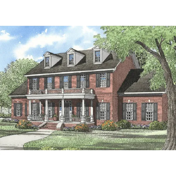 Traditional Two-Story Brick House With Pillared Porch And Balcony Above