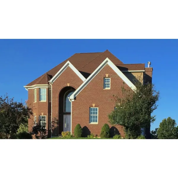 Home With Dramatic Arched Brick Entry