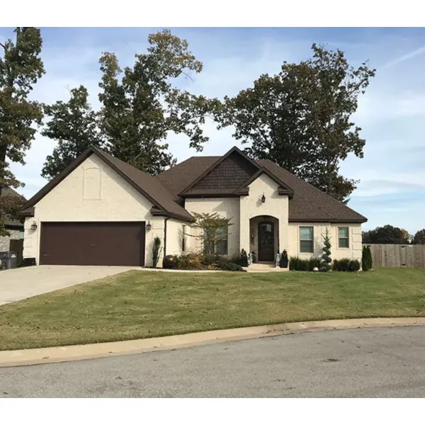 Arched Entry Is Just Part Of This Traditional Homes Style