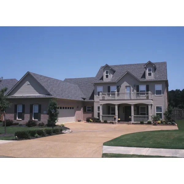 Luxury Two-Story Home With Plantation Style Covered Porch And Balcony