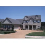 Luxury Two-Story Home With Plantation Style Covered Porch And Balcony