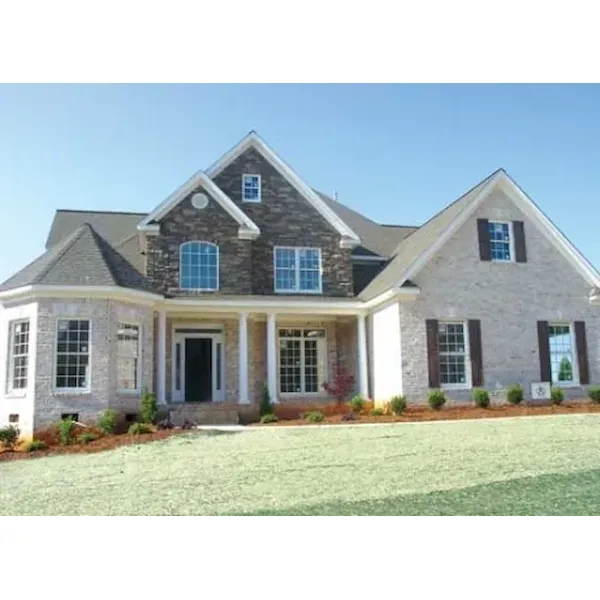 Shingle Siding And Stone Add Nostalgia To This Home Design