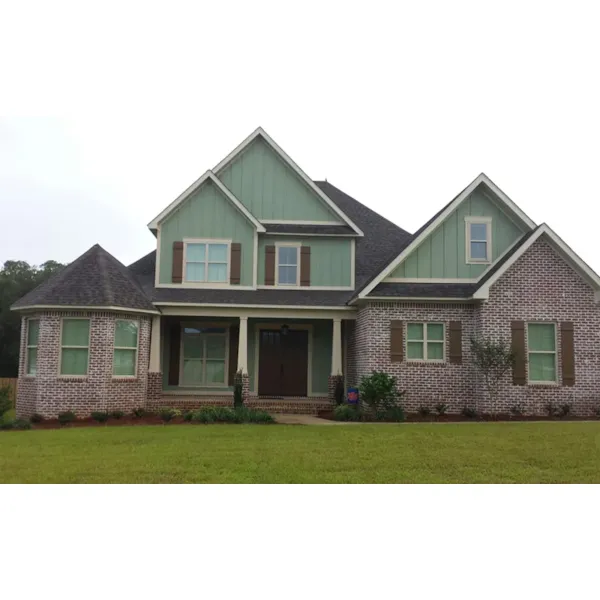 Shingle Siding And Stone Add Nostalgia To This Home Design