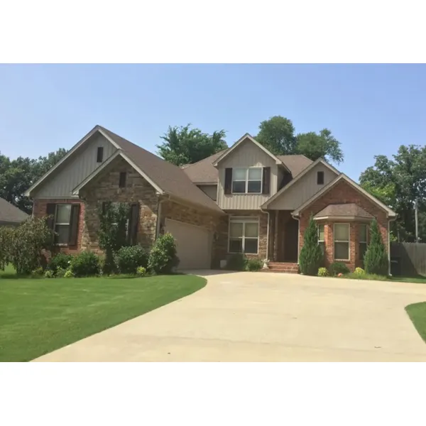 Patterned Stone Accents Add Country French Style To This Two-Story Home