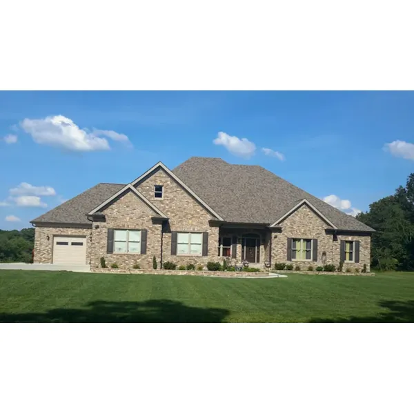 Country Home With Prominent Arches And Twin Dormers