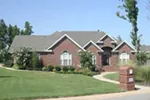 All Brick Traditional Home With Dramatic Arches